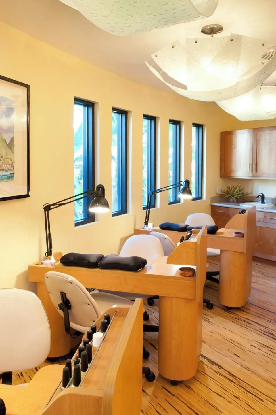 Nail salon stations with task lamps are shown inside Sheraton Maui Resort & Spa.