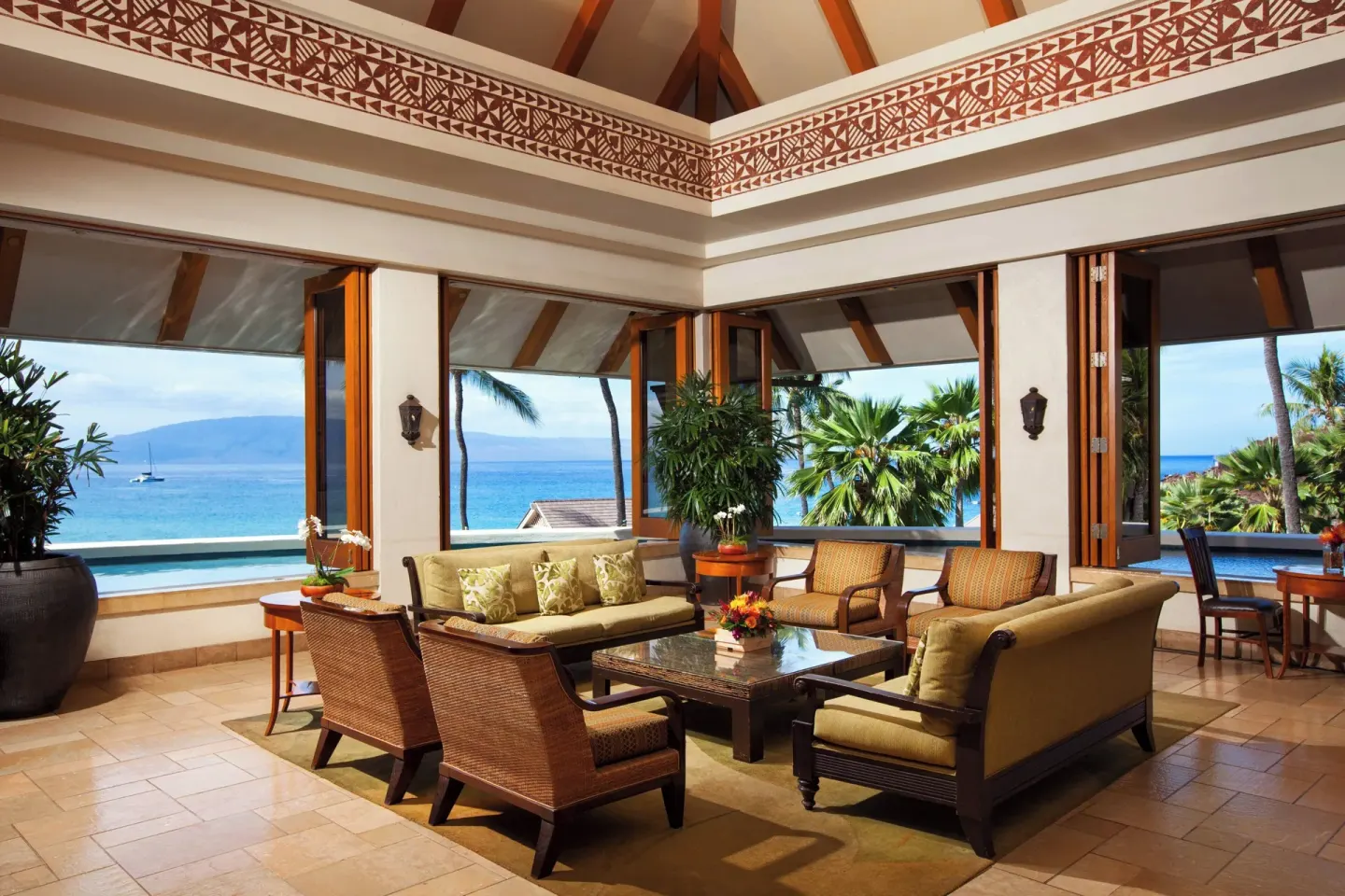 Open-air lobby seating with ocean views at Sheraton Maui Resort & Spa.