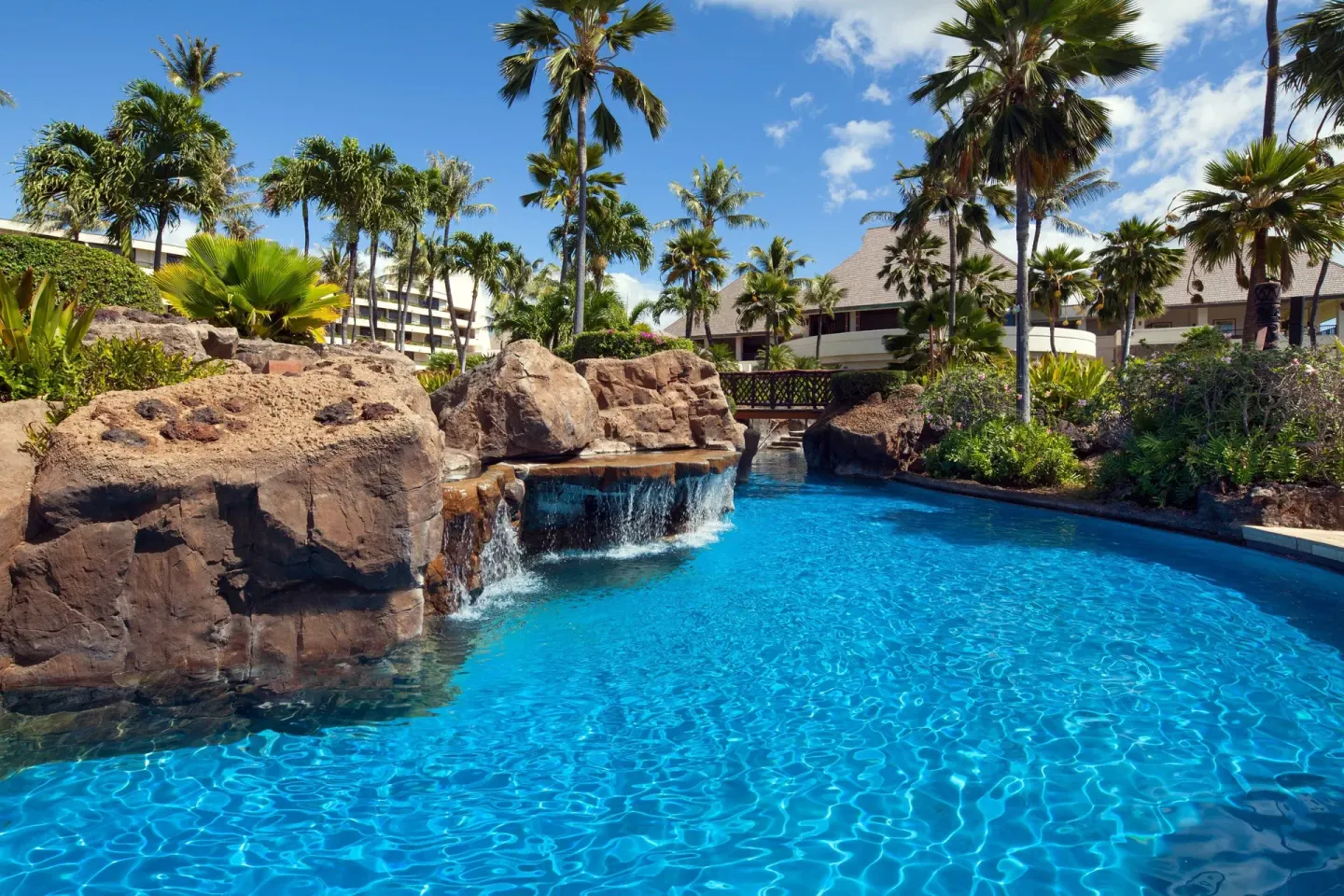 Rock waterfall and blue resort pool at Sheraton Maui Resort & Spa.