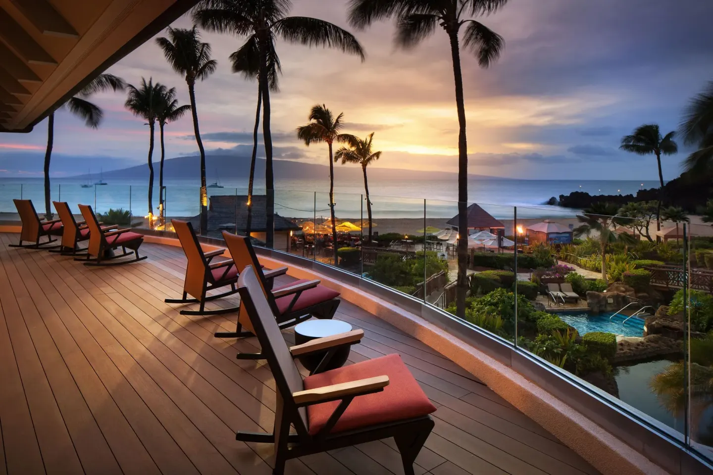 Sunset ocean view from a deck with lounge chairs at Sheraton Maui Resort & Spa.