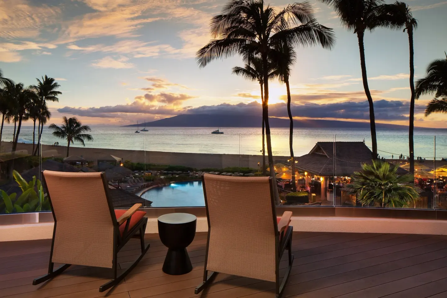 Sunset terrace seating overlooking the pool and ocean at Sheraton Maui Resort & Spa.