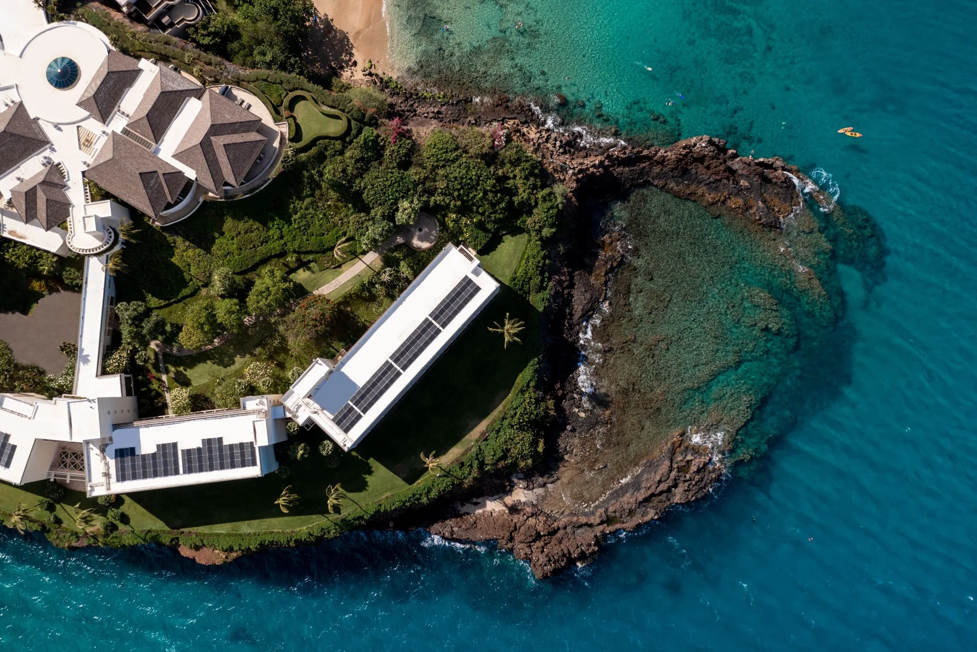 Top-down aerial view of rocky shoreline and clear water at Sheraton Maui Resort & Spa.