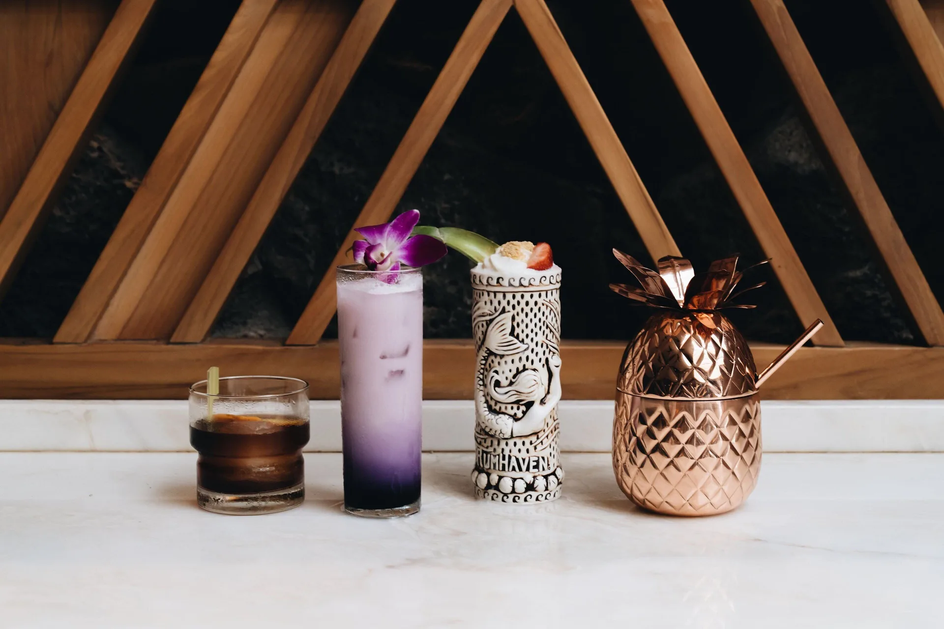 Four assorted cocktails on a bar counter at Sheraton Maui Resort & Spa.