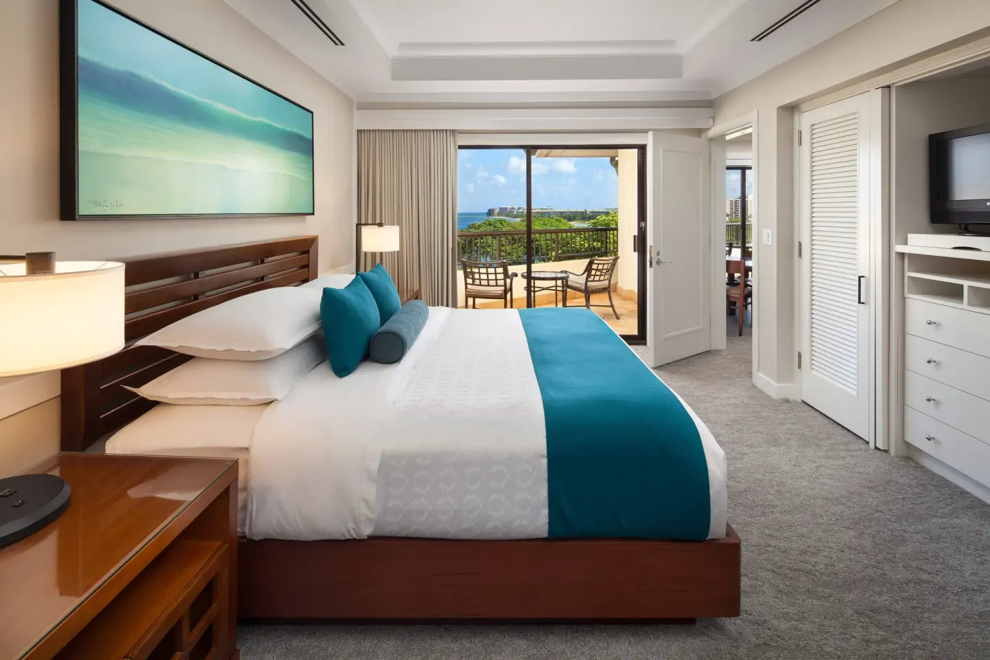 King bed in an ocean view suite bedroom at Sheraton Maui Resort & Spa.