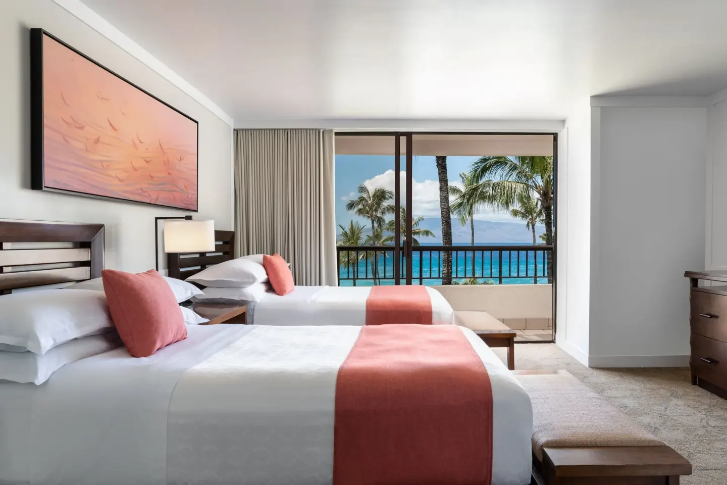 Two double beds in an ocean view suite bedroom at Sheraton Maui Resort & Spa.