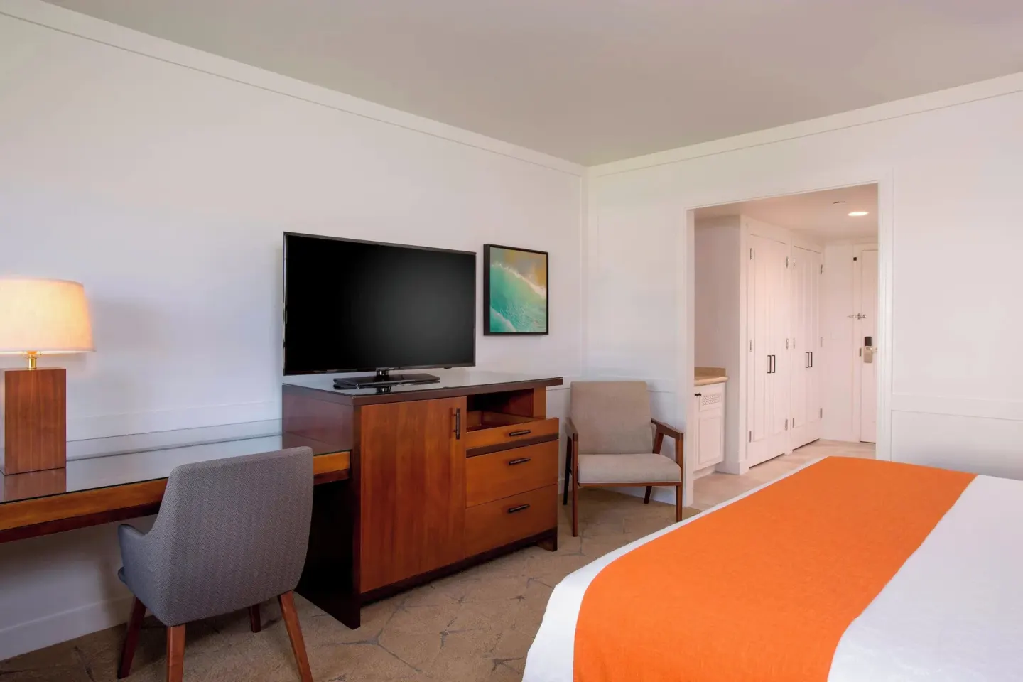 Deluxe Ocean View room desk and TV area at Sheraton Maui Resort & Spa.