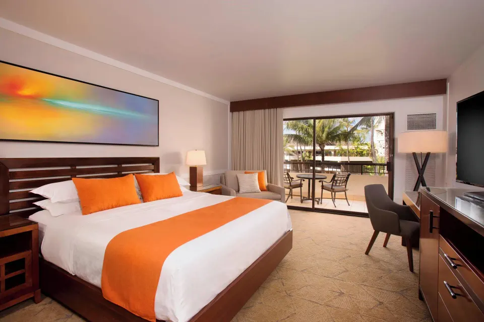 Deluxe Ocean View king room with seating and balcony at Sheraton Maui Resort & Spa.