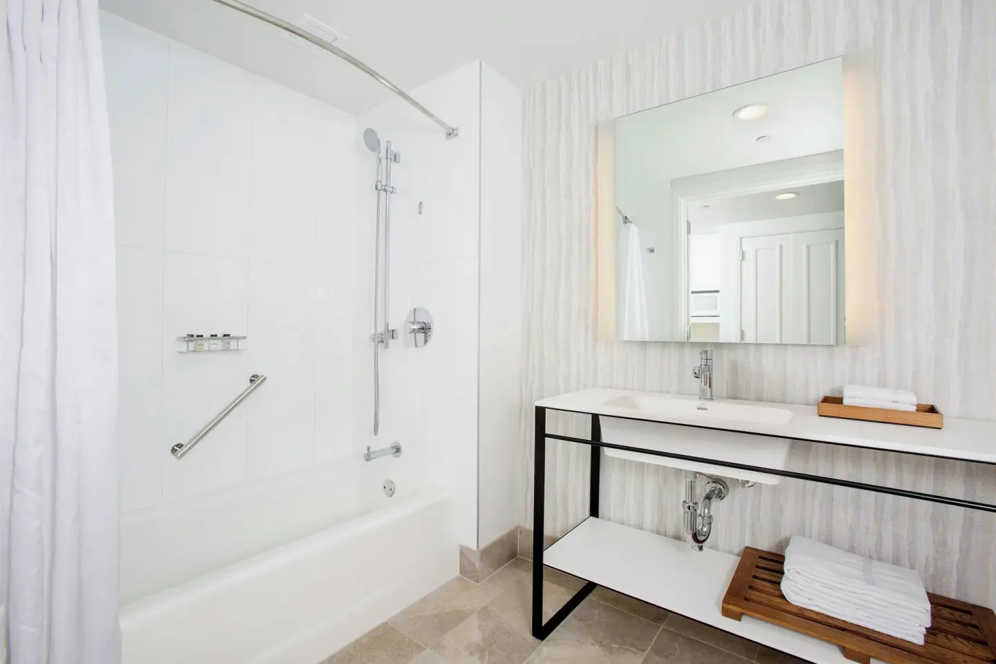 Resort View room bathroom with tub-shower and long vanity at Sheraton Maui Resort & Spa.