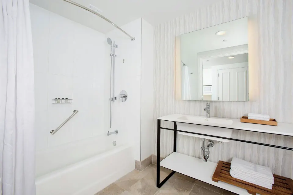 Resort View room bathroom with tub-shower and long vanity at Sheraton Maui Resort & Spa.