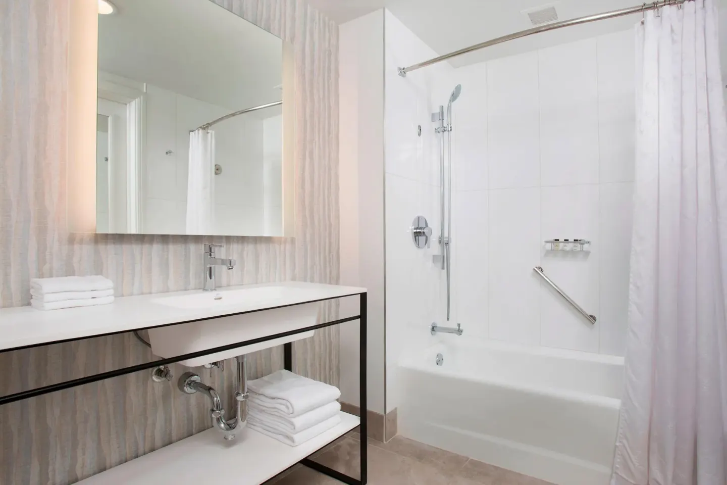 Resort View room bathroom with vanity and tub-shower at Sheraton Maui Resort & Spa.