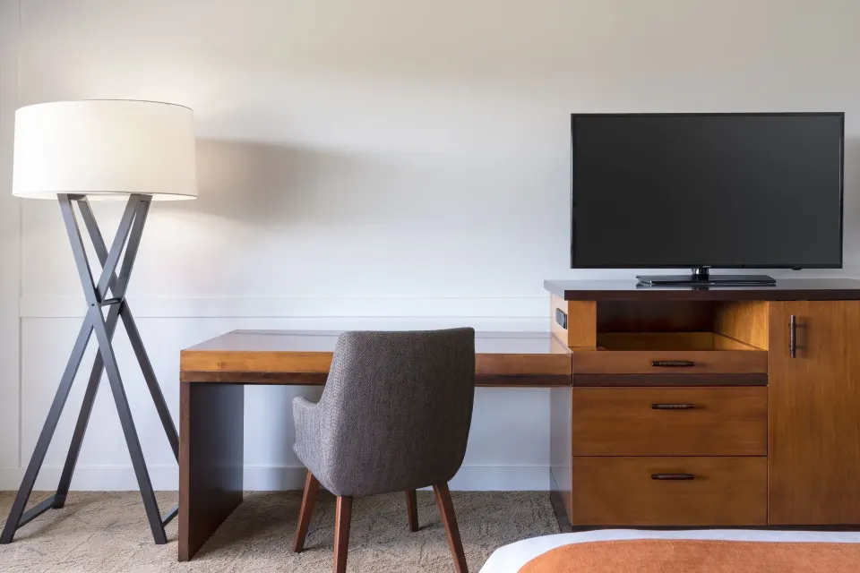 Desk, floor lamp, and TV area in a Resort View room at Sheraton Maui Resort & Spa.