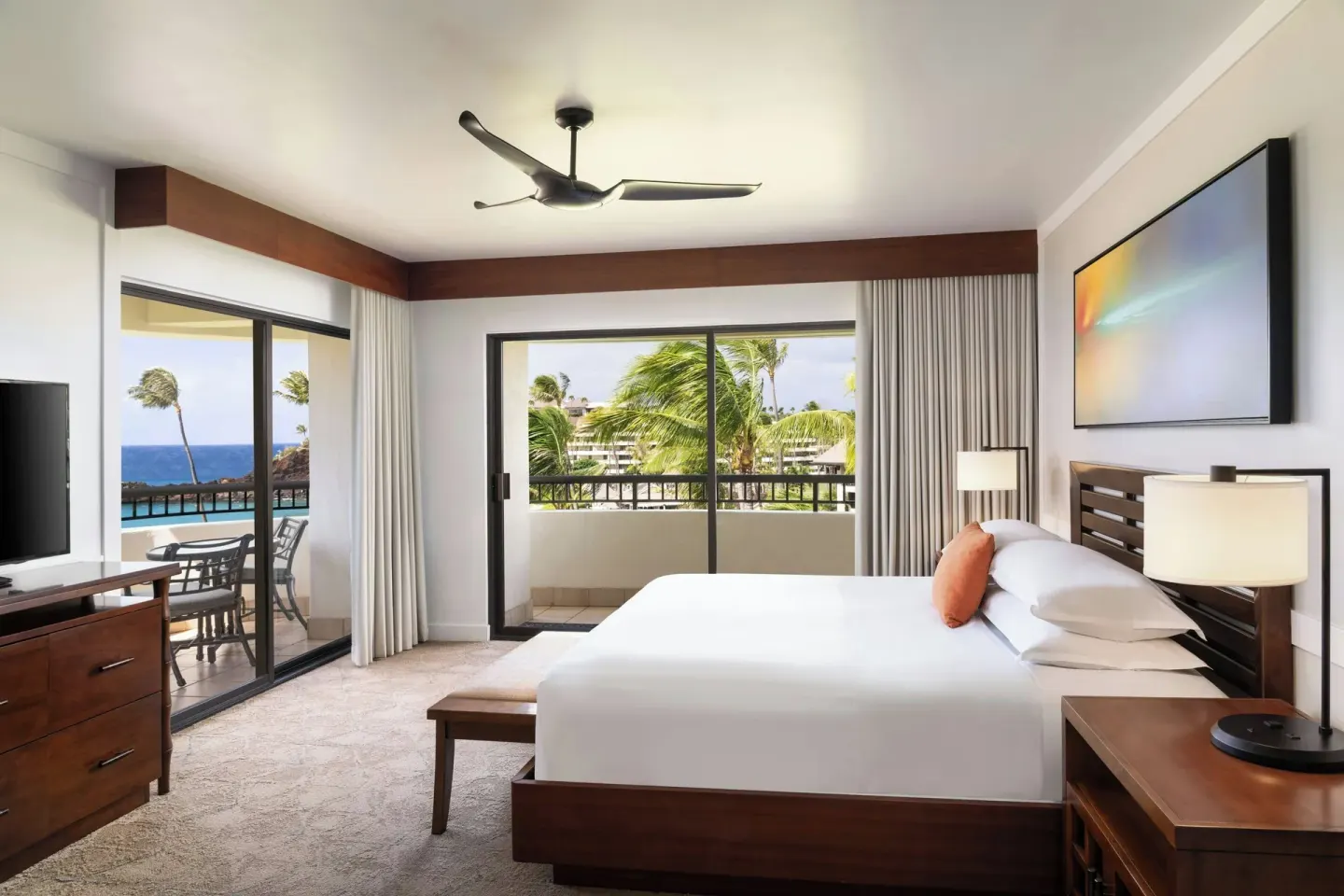 Oceanfront one-bedroom suite king bed and balcony at Sheraton Maui Resort & Spa.