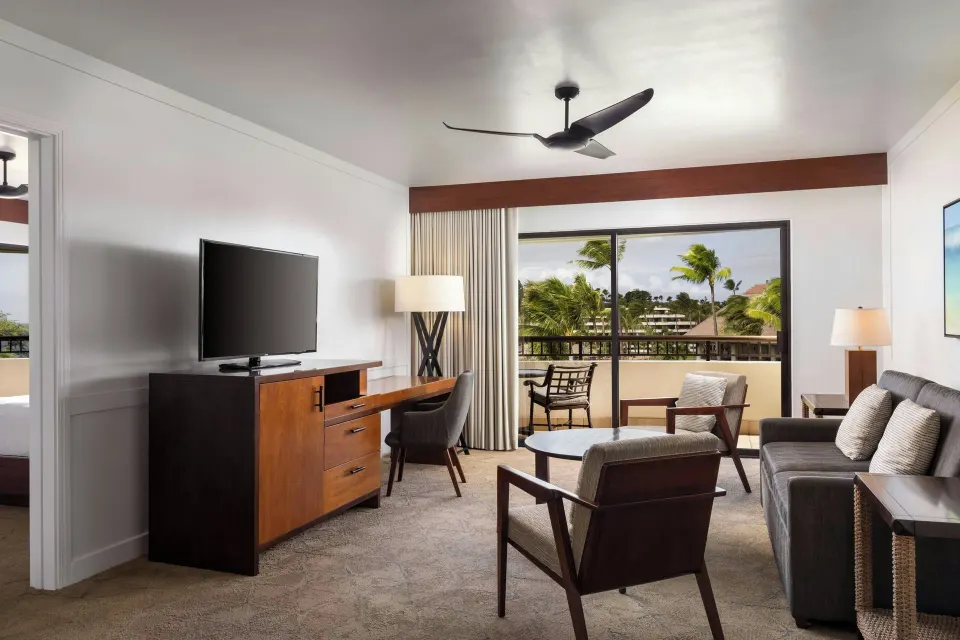 Oceanfront suite living room with balcony at Sheraton Maui Resort & Spa.