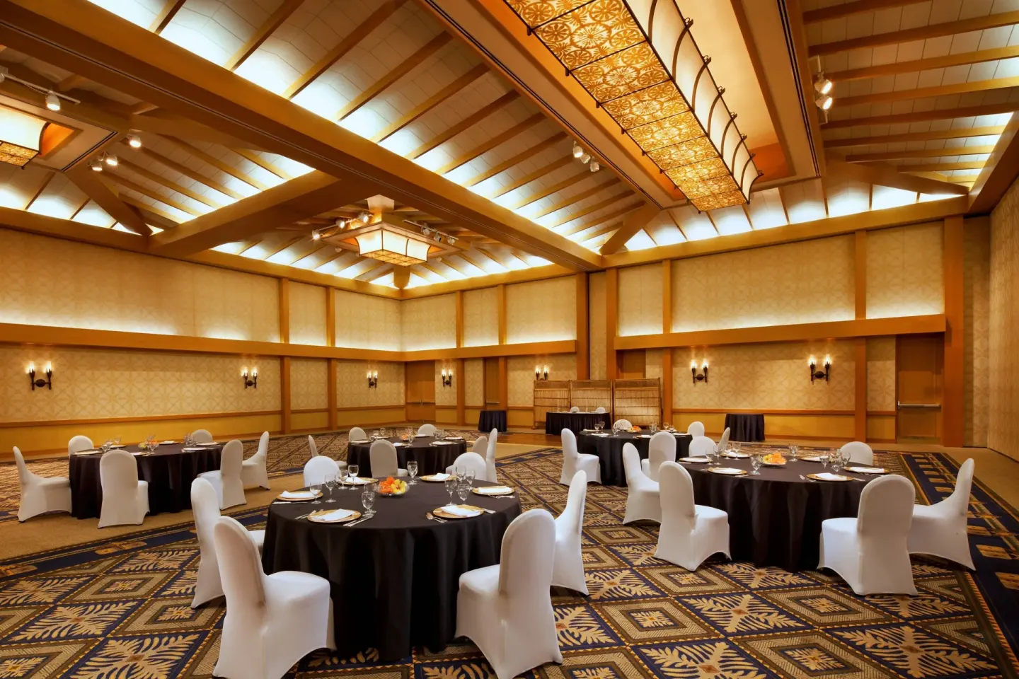 Banquet ballroom with round dining tables at Sheraton Maui Resort & Spa.