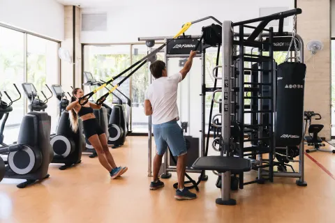 Guests use suspension straps and gym equipment at Sheraton Princess Kaiulani.