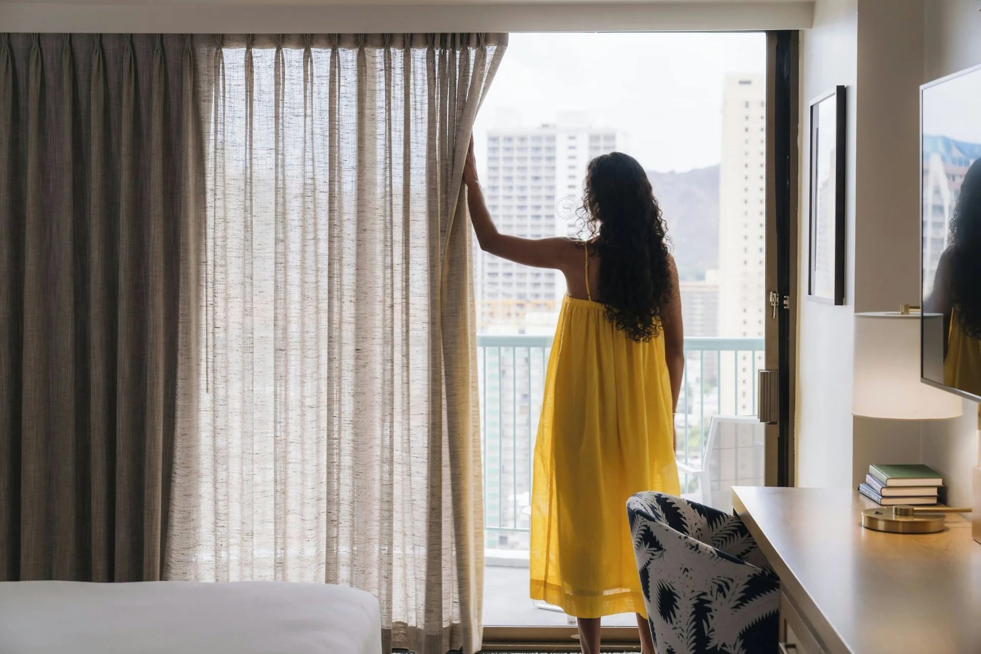 Guest room balcony door with sheer curtains at Sheraton Princess Kaiulani.