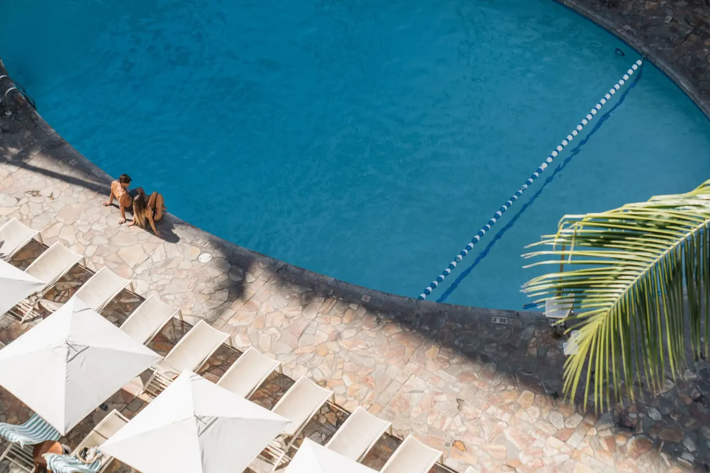 Overhead view of the pool deck and curved pool edge at Sheraton Princess Kaiulani.