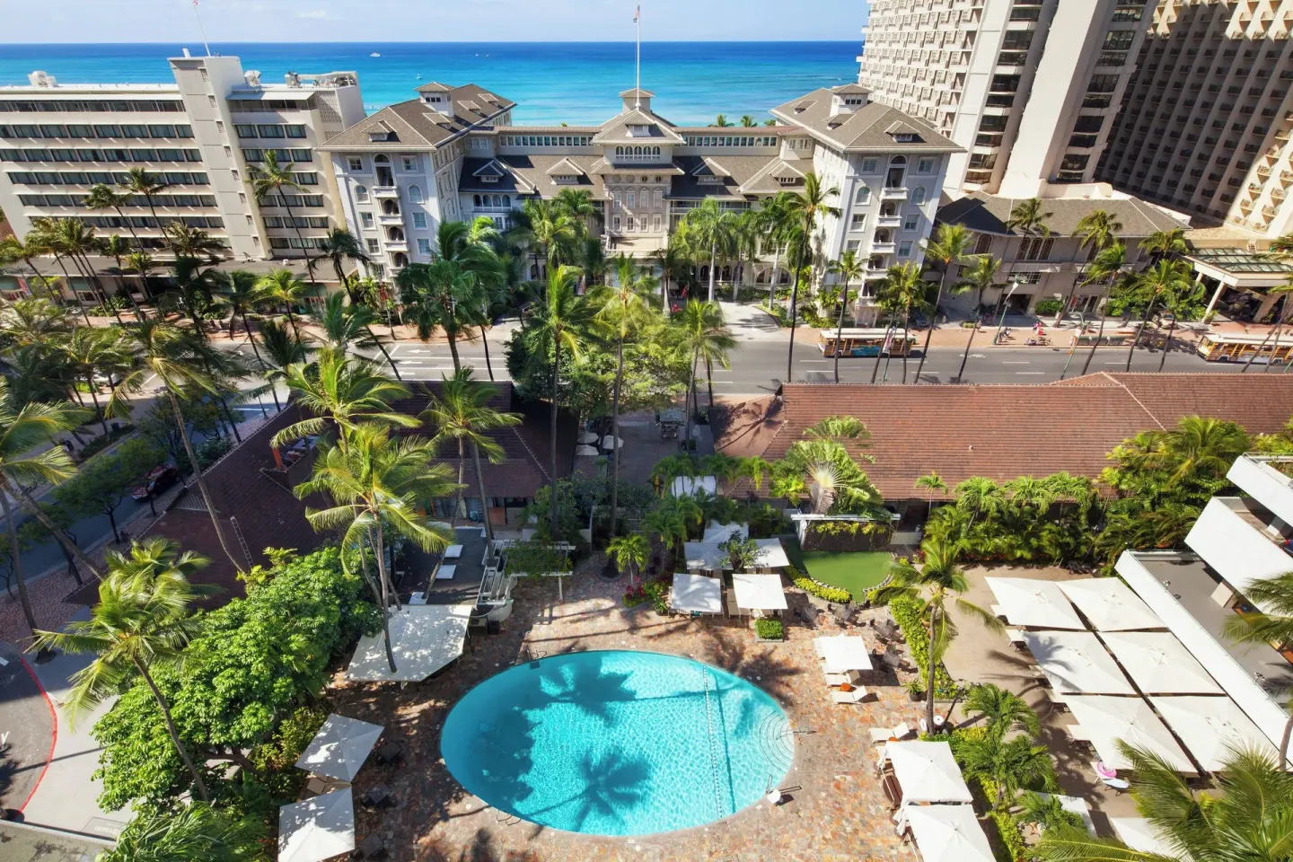 Aerial view of the pool courtyard and Waikiki shoreline at Sheraton Princess Kaiulani.