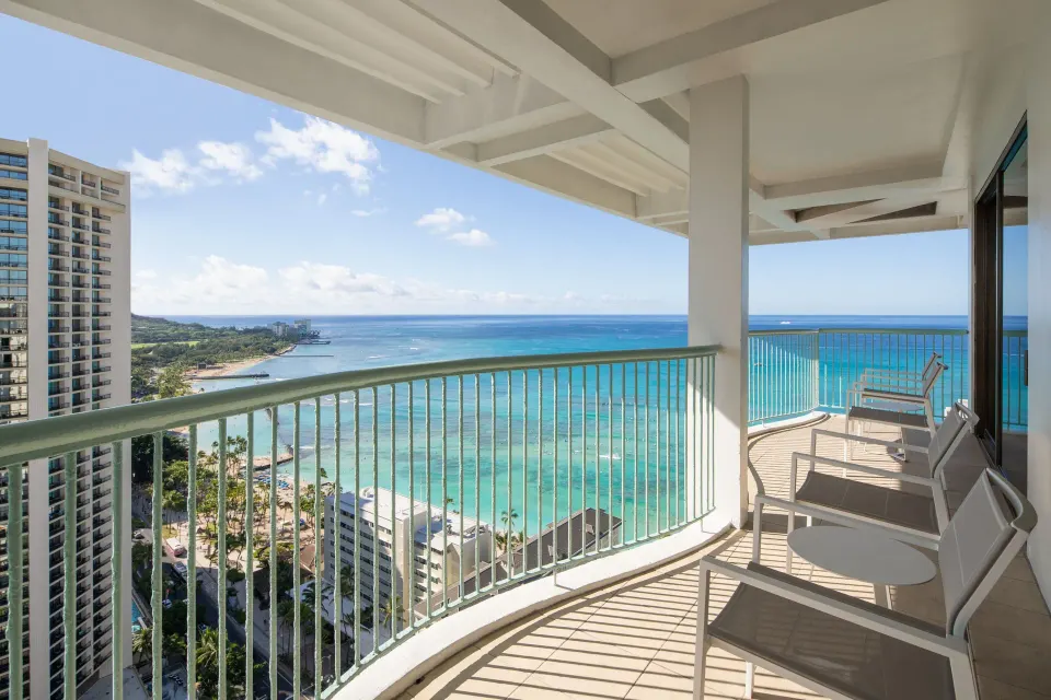 Renovated Corner Jr. Suite balcony at Sheraton Princess Kaiulani overlooking Waikiki Beach and the ocean.