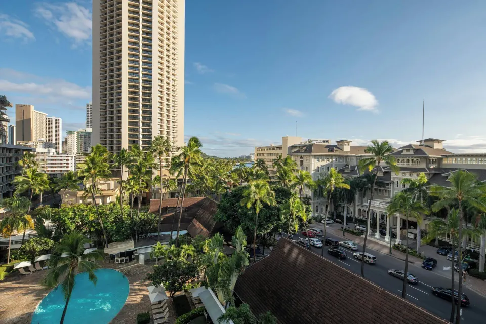 Pool view with palms and Waikiki street from Sheraton Princess Kaiulani.