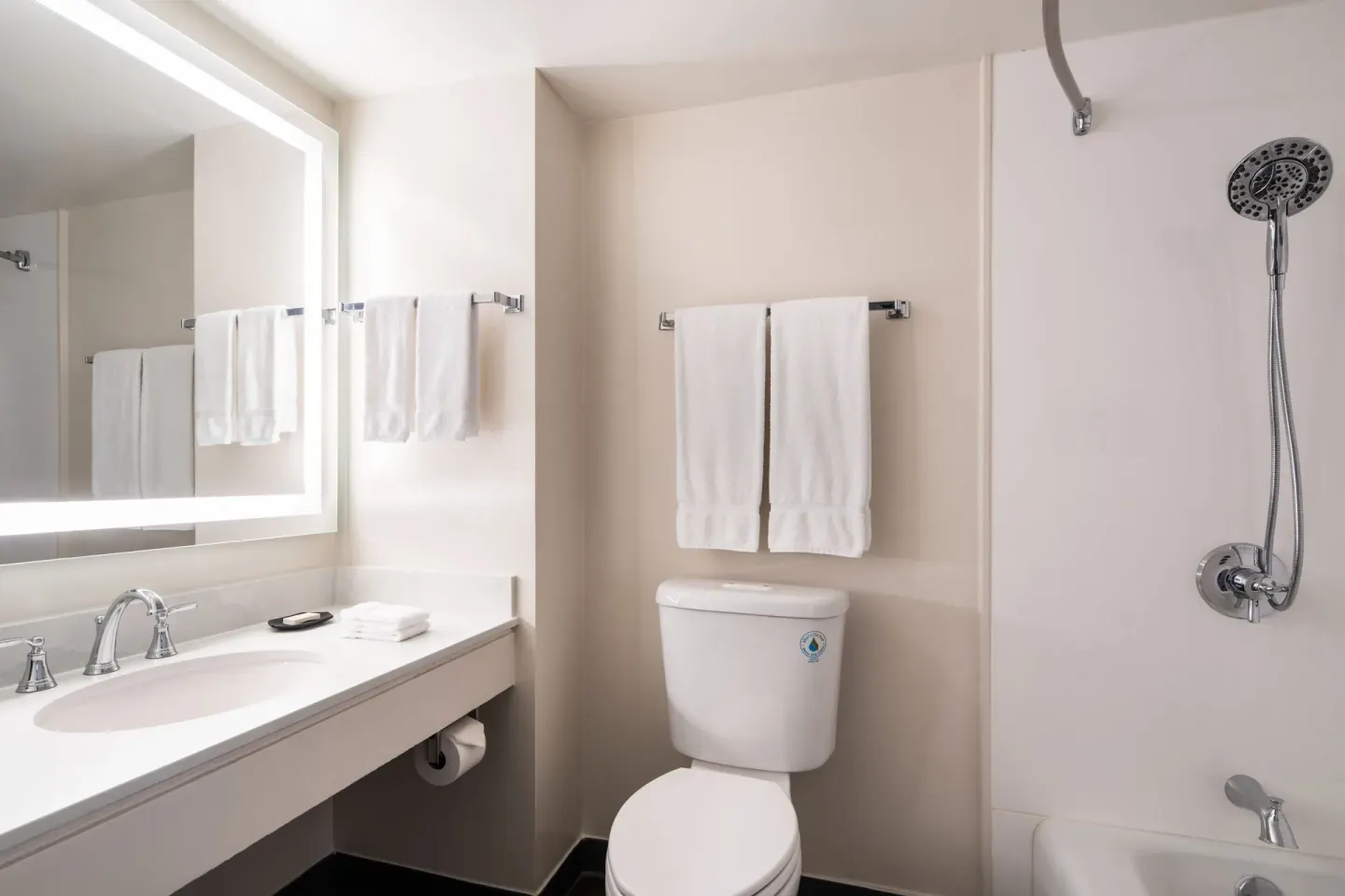 Standard Room bathroom vanity, toilet, and shower at Sheraton Princess Kaiulani.