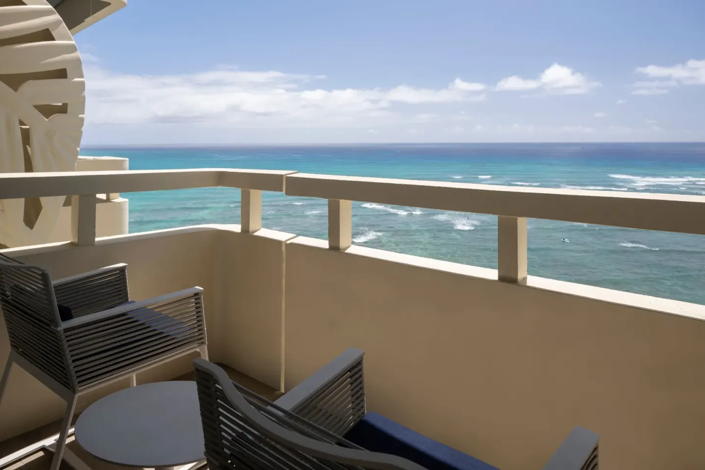 Furnished balcony overlooking the Pacific Ocean at Sheraton Waikiki Beach Resort.