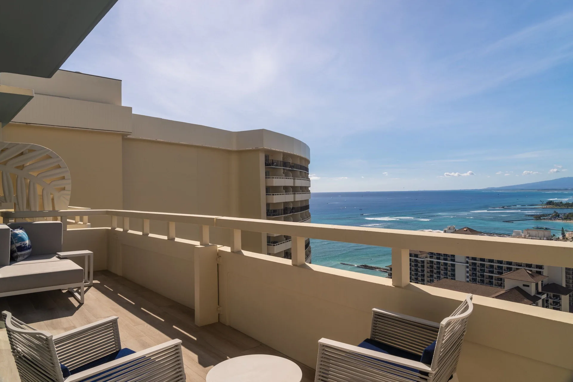 Furnished terrace at Sheraton Waikiki Beach Resort with ocean and skyline views.