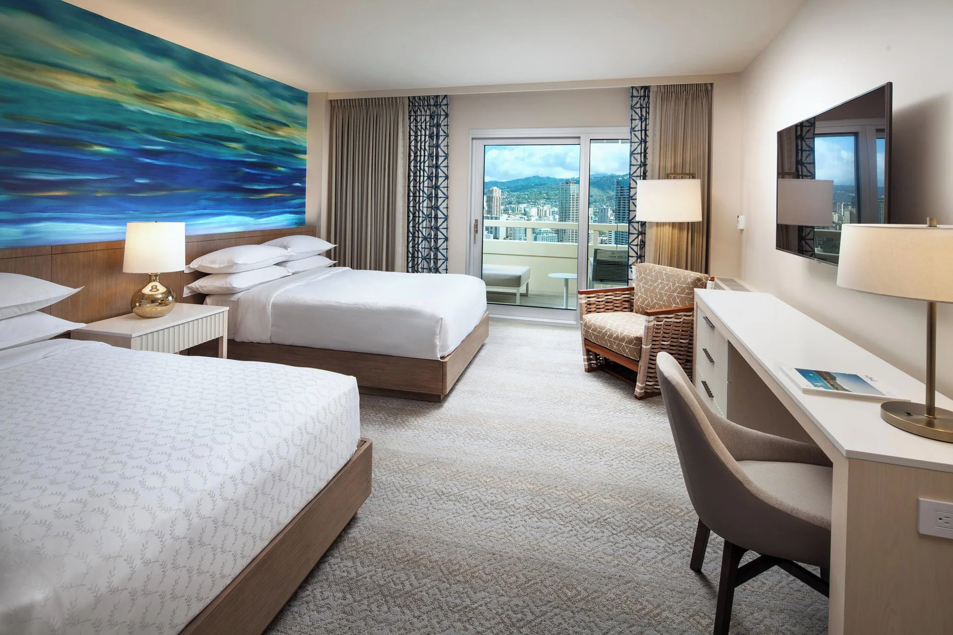 Two-bed City View guest room with balcony at Sheraton Waikiki Beach Resort.