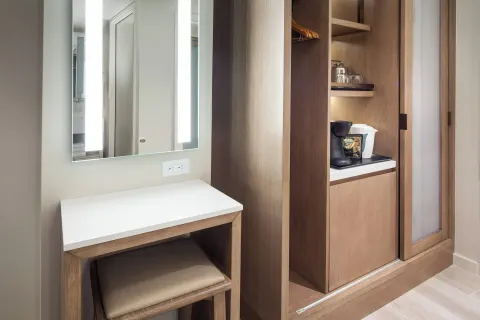 City View room vanity, closet, and beverage area at Sheraton Waikiki Beach Resort.