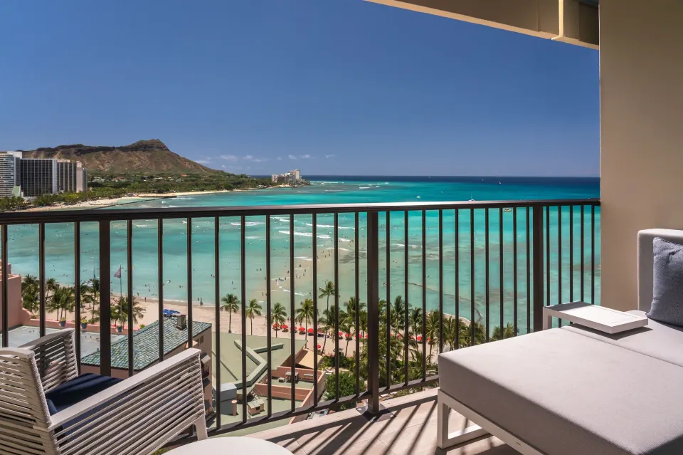 Balcony seating overlooks Waikiki Beach and Diamond Head at Sheraton Waikiki Beach Resort.