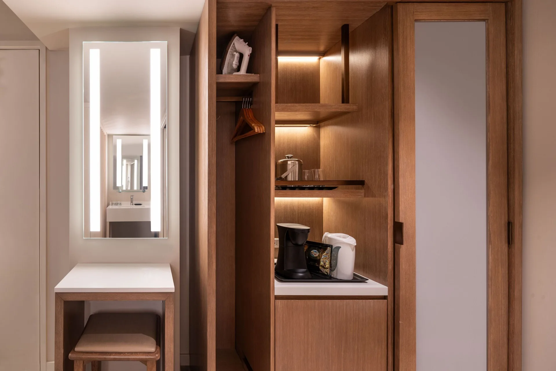 Guest room vanity, closet, and beverage station at Sheraton Waikiki Beach Resort.