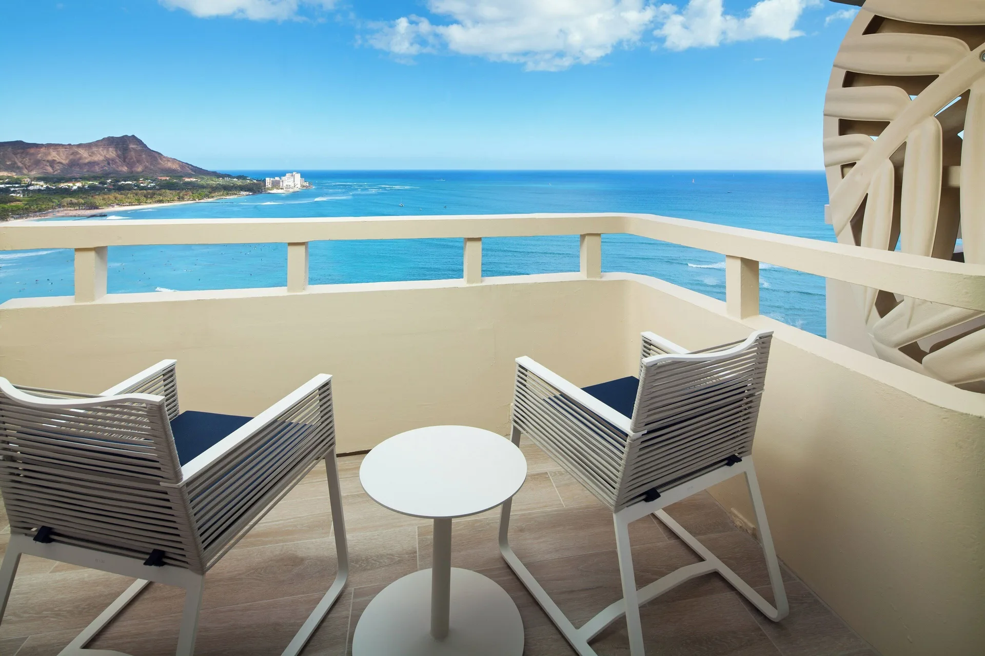 Oceanfront balcony seating with Diamond Head view at Sheraton Waikiki Beach Resort.