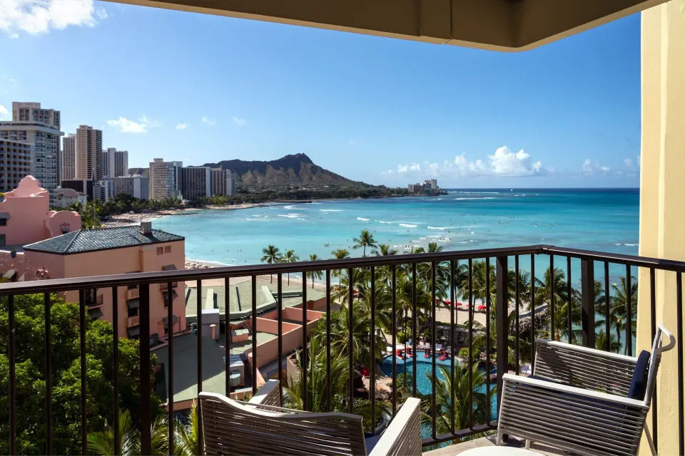 Malia Suite balcony seating overlooking Waikiki Beach at Sheraton Waikiki Beach Resort.