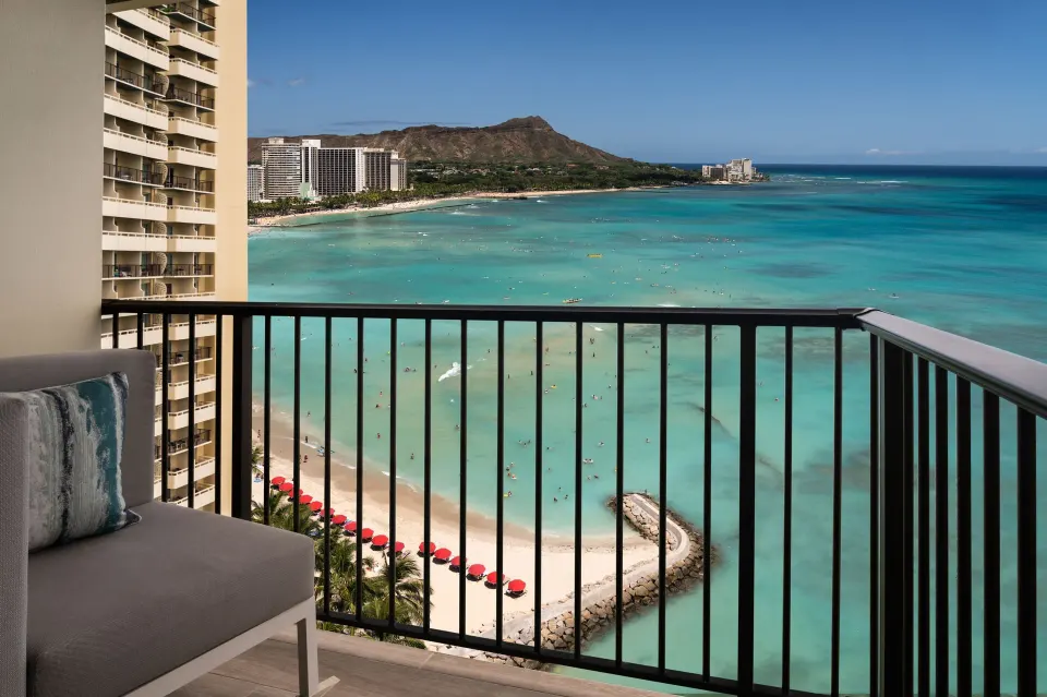 Oceanfront suite balcony view of Waikiki Beach and Diamond Head at Sheraton Waikiki Beach Resort.