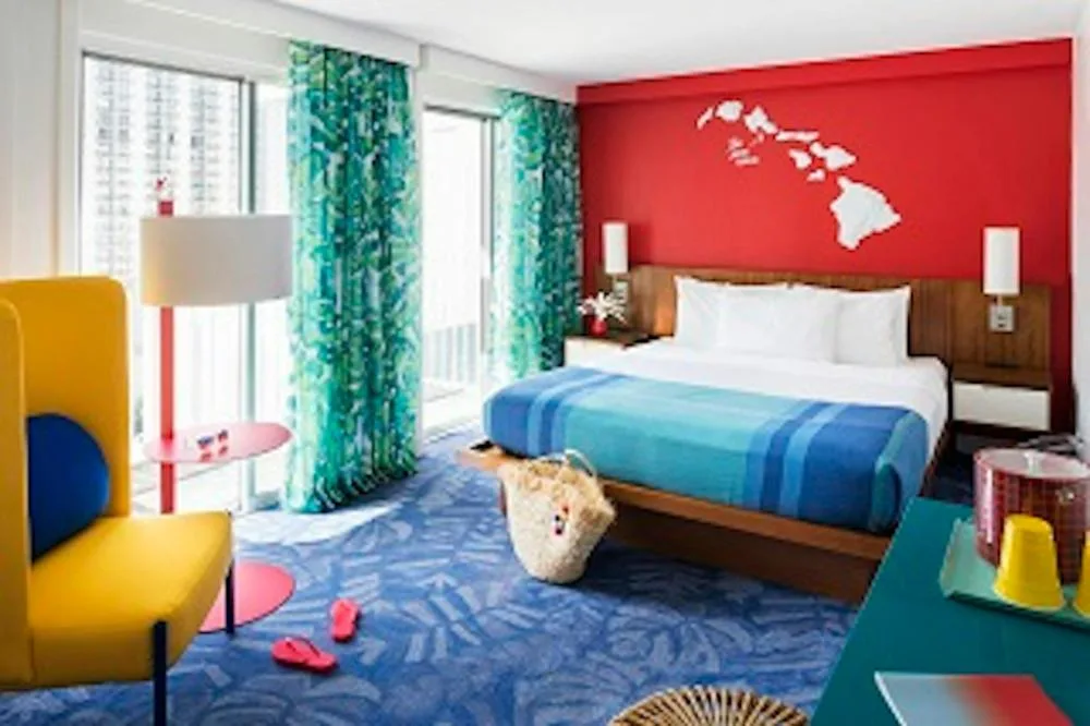 Standard king guest room with bright decor at Shoreline Hotel Waikiki.