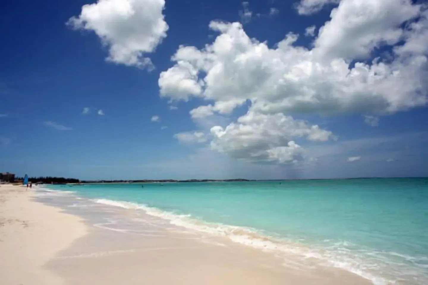 Wide sandy beach with turquoise water near Sibonné Beach Hotel.