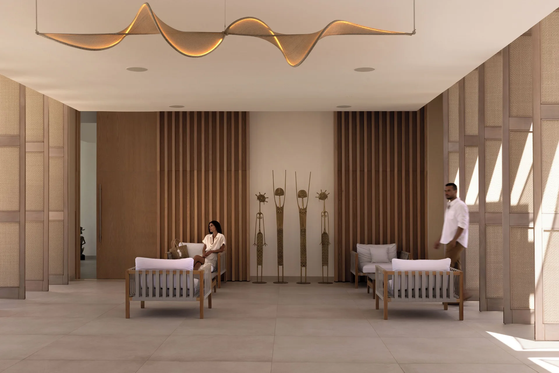Shaded lounge seating in the lobby area at Silversands Beach House Grenada.