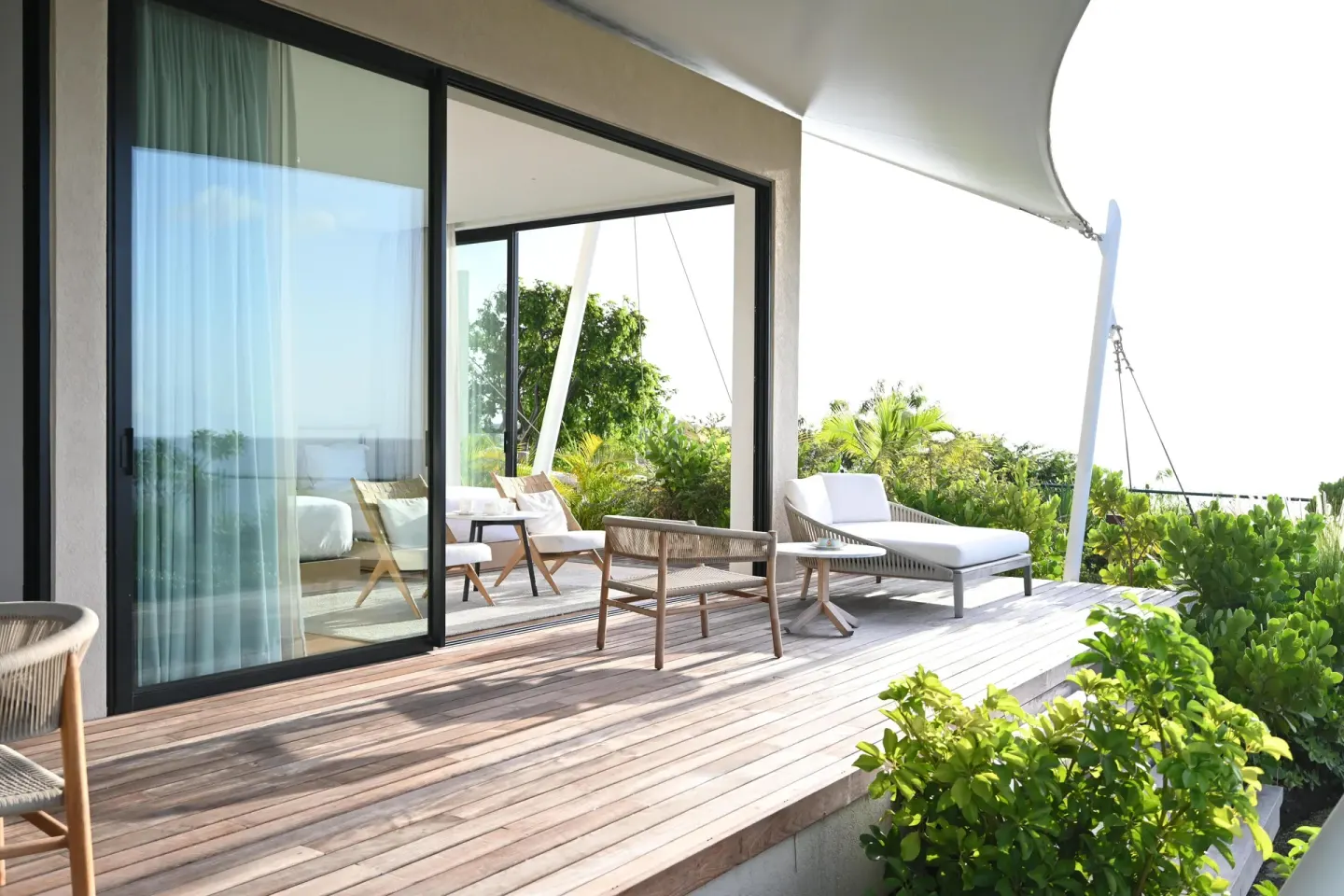 Private wooden terrace with lounge seating at Silversands Beach House Grenada.