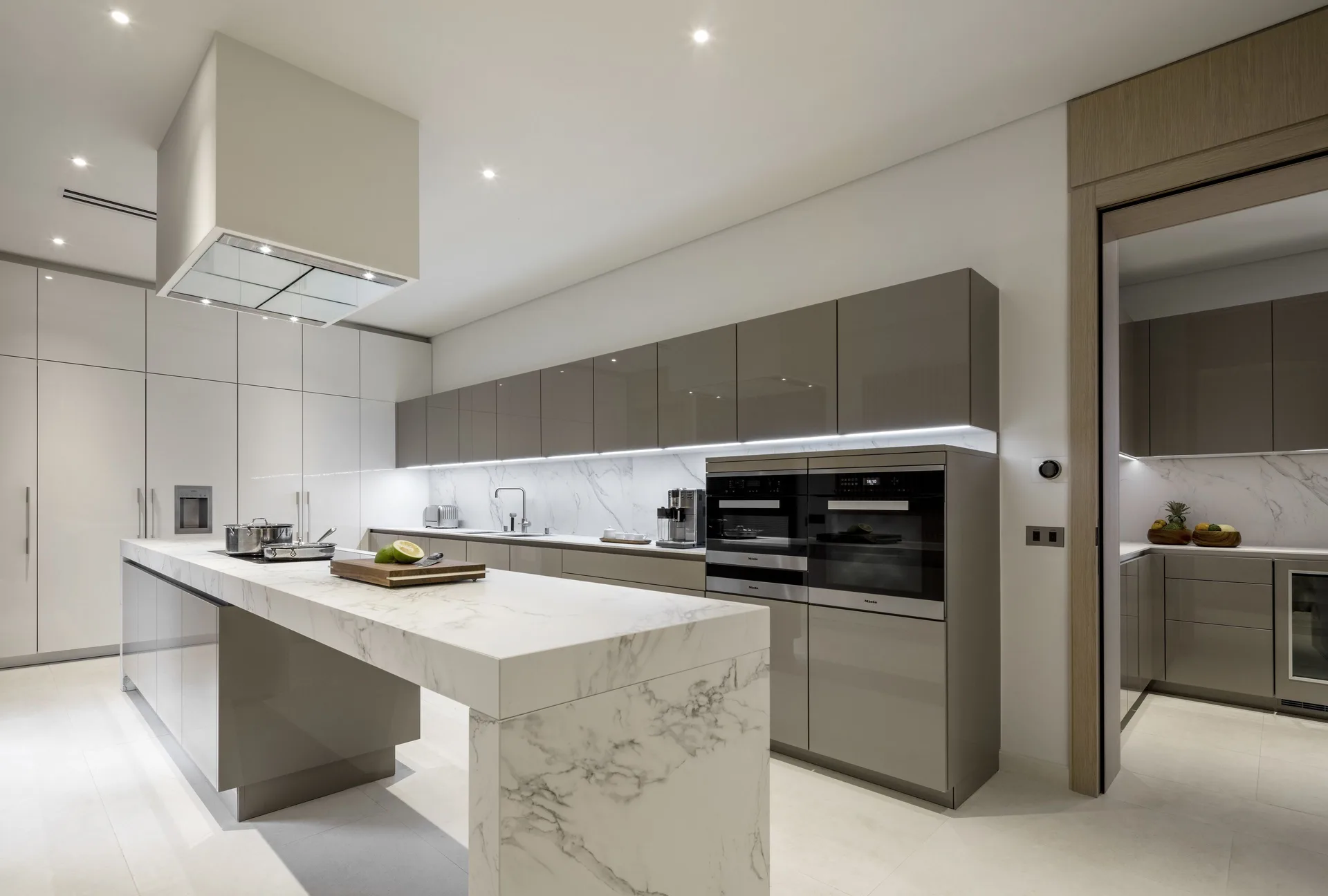 Modern villa kitchen with marble island at Silversands Beach House Grenada.