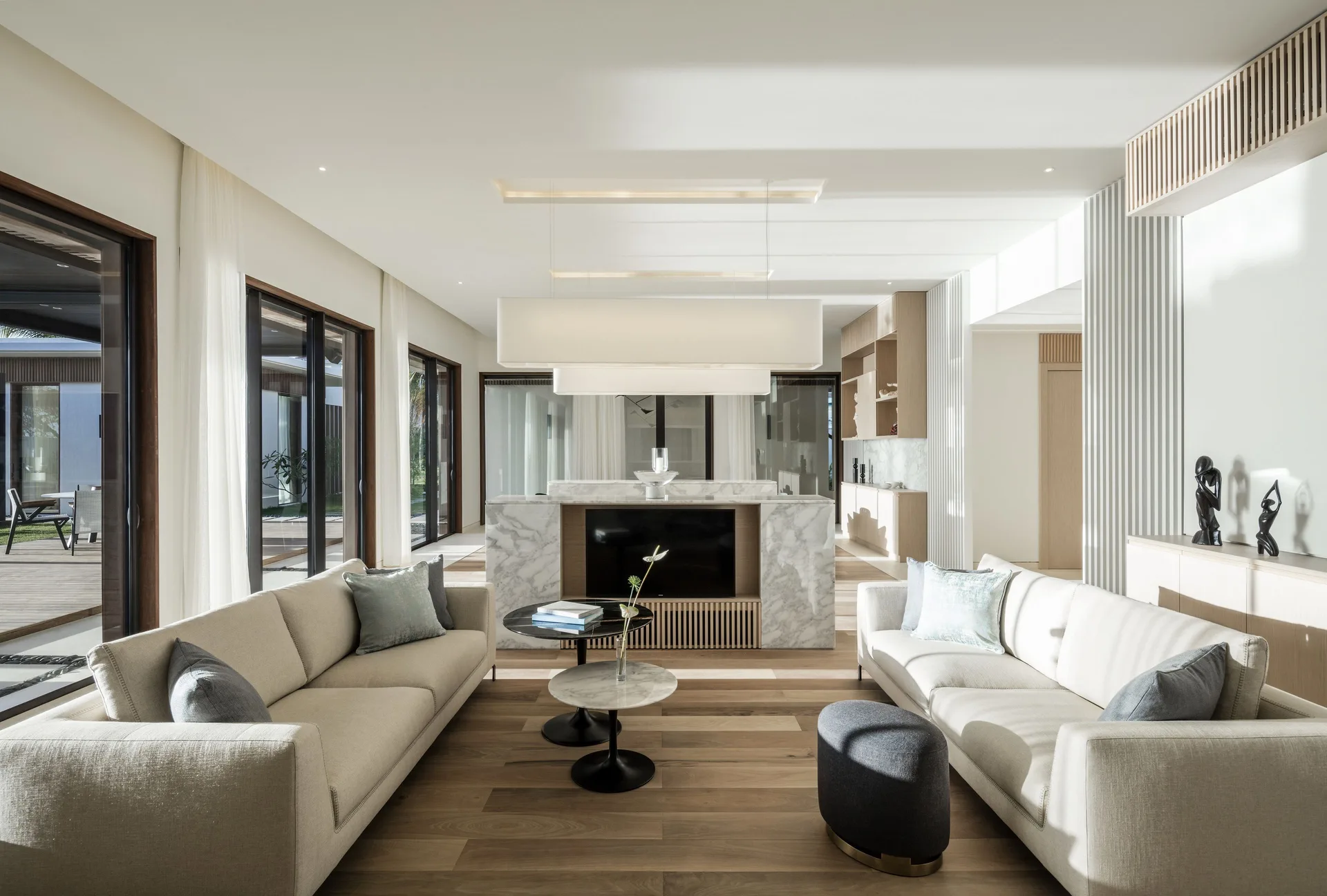 Villa living room with sofas and media wall at Silversands Beach House Grenada.