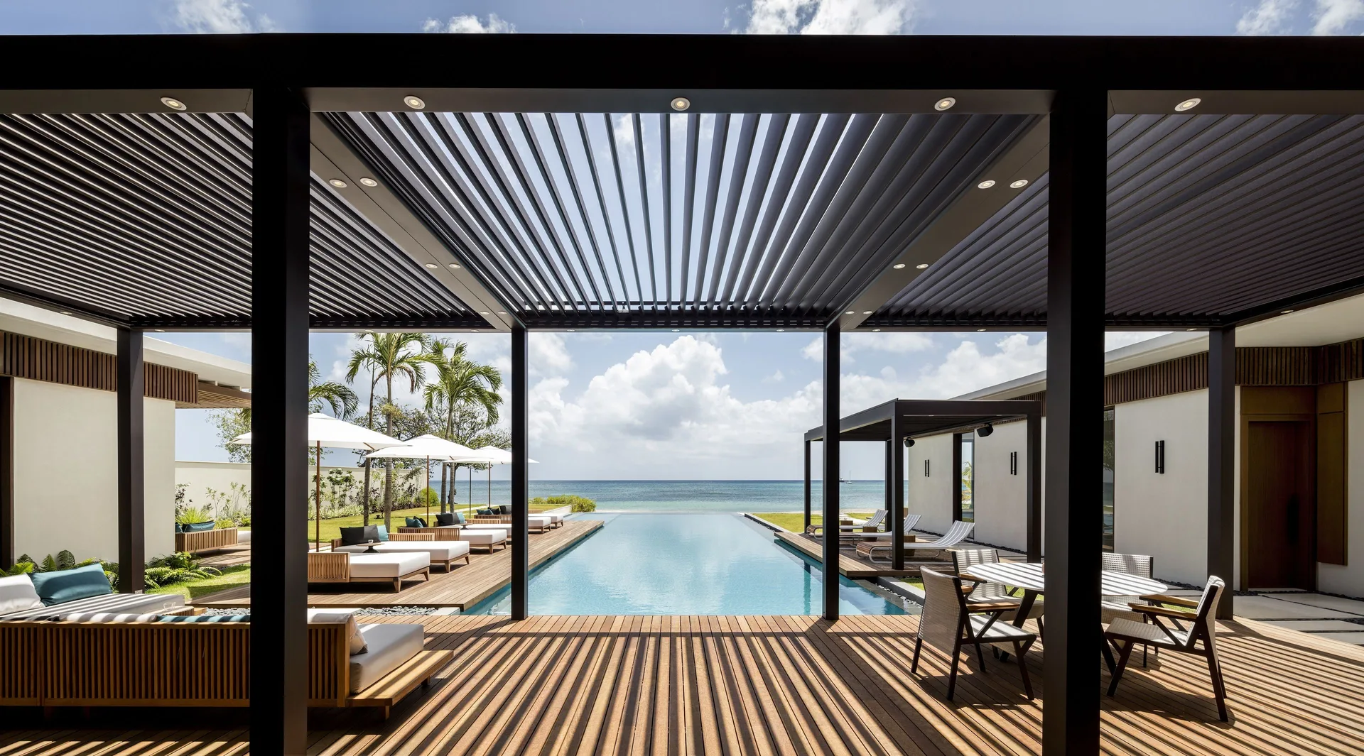 Beachfront villa terrace, pool and ocean at Silversands Beach House Grenada.
