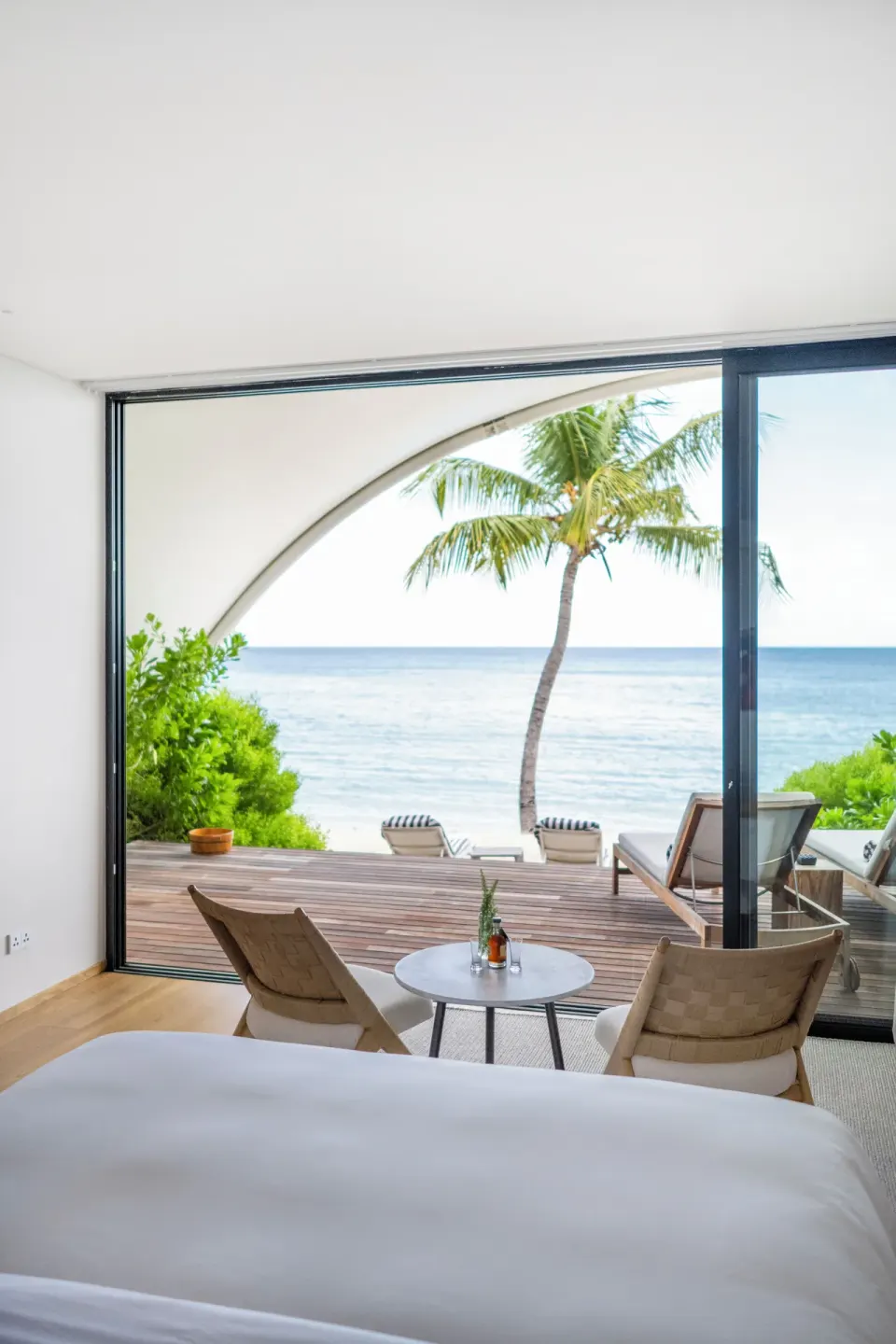 Beachfront Bungalow king bed facing the ocean at Silversands Beach House Grenada.
