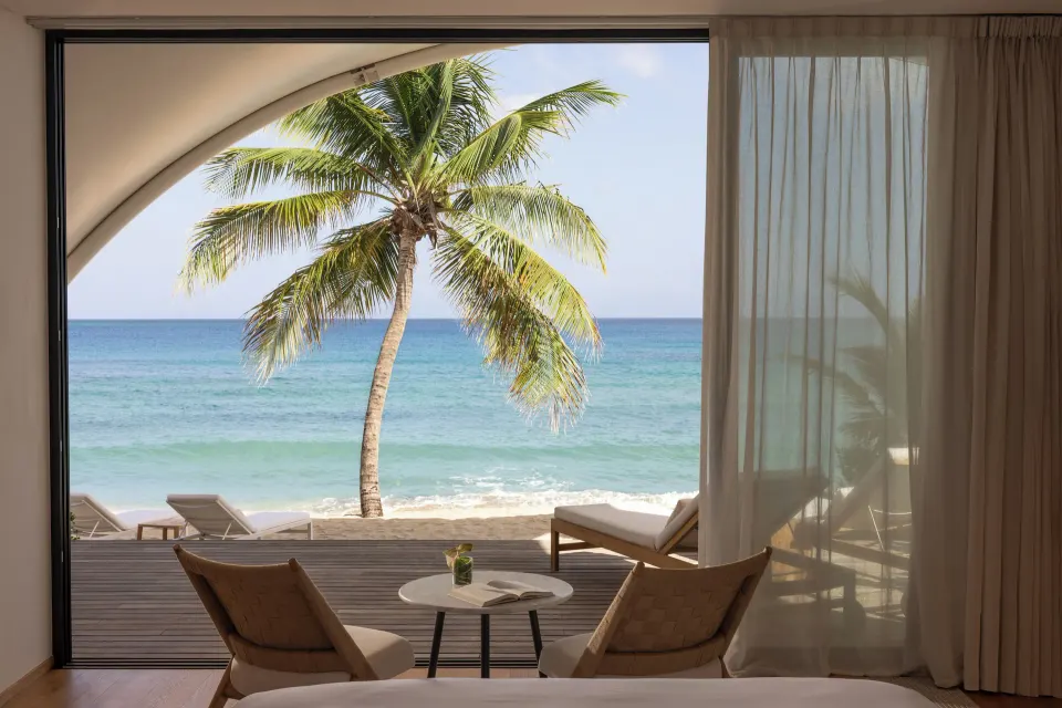 Beachfront Bungalow seating area and ocean view at Silversands Beach House Grenada.