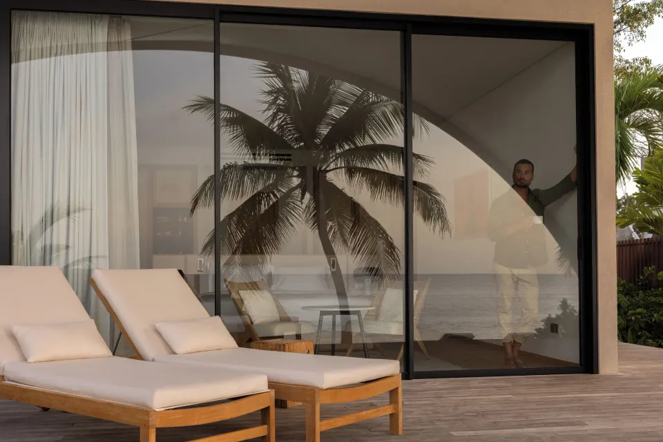 Beachfront Bungalow terrace with loungers at Silversands Beach House Grenada.