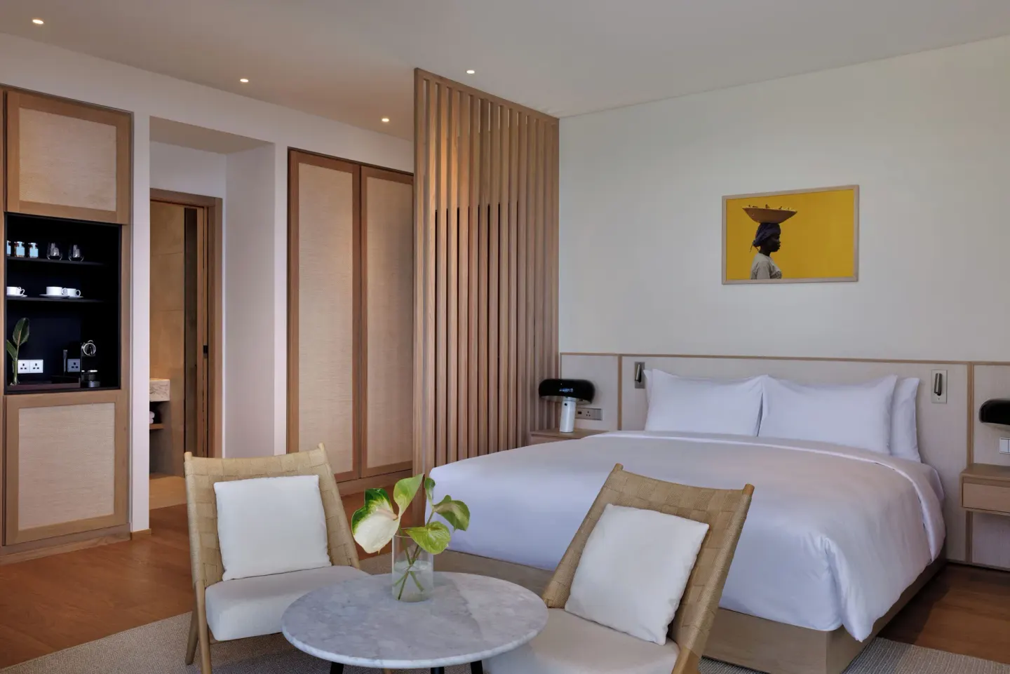 Island View guest room with king bed and sitting area at Silversands Beach House Grenada.
