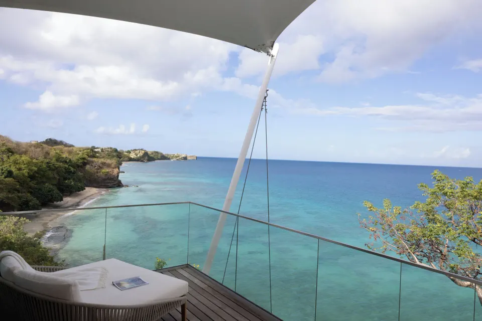 Ocean View room balcony with sea and coastline views at Silversands Beach House Grenada.