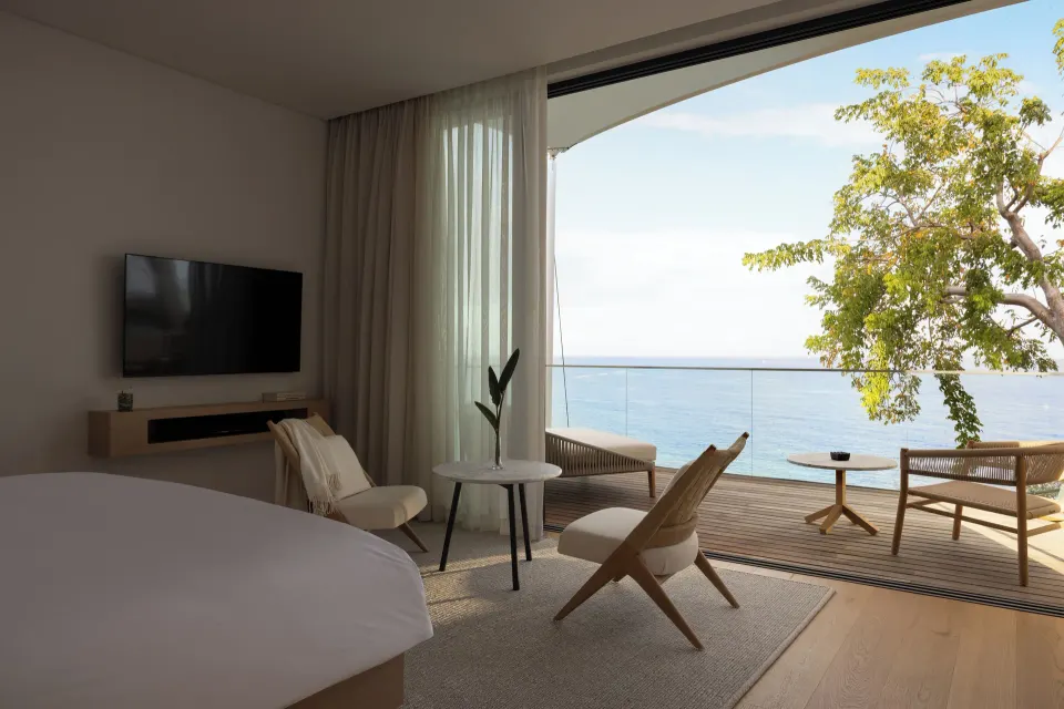Ocean View room opening to a furnished sea-facing terrace at Silversands Beach House Grenada.