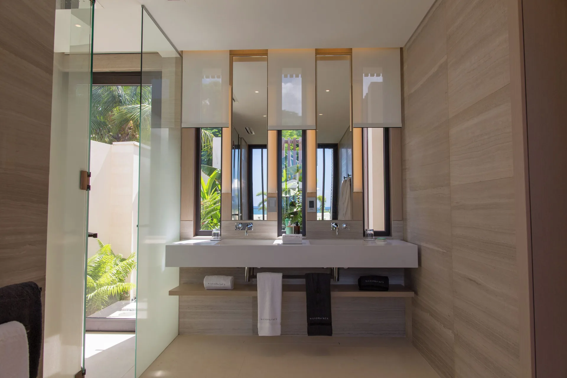 Three Bedroom Oceanview Villa bathroom vanity and glass shower at Silversands Beach House Grenada.