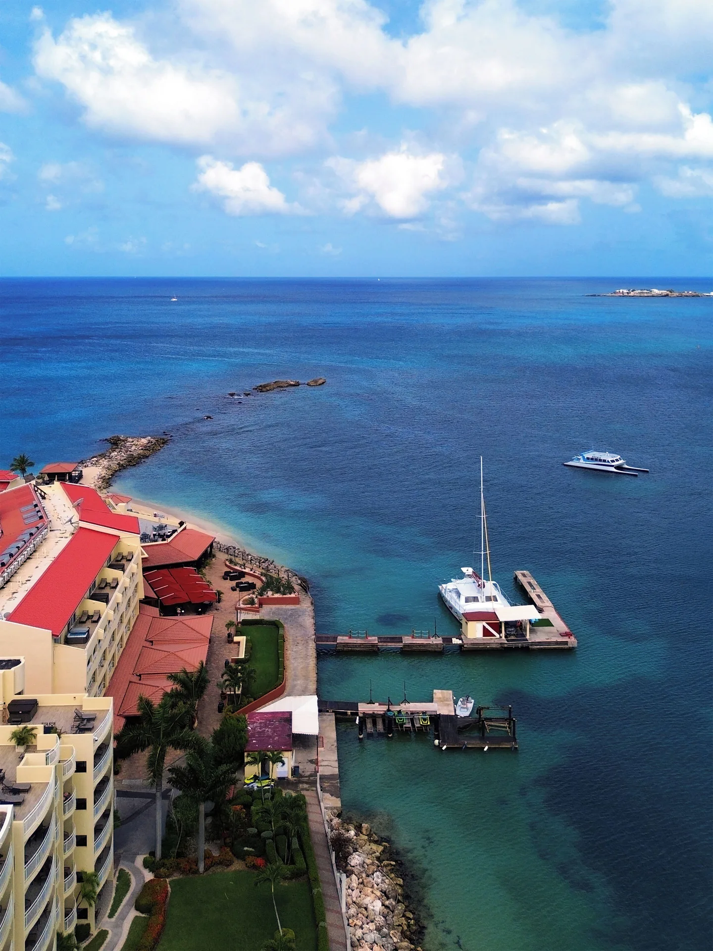 Marina docks and blue bay beside Simpson Bay Resort, Marina & Spa.