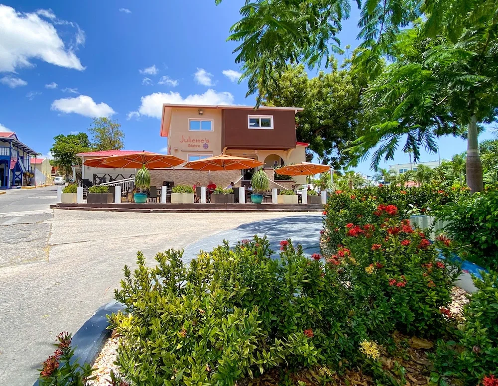 Juliette's Bistro patio and garden walkway at Simpson Bay Resort, Marina & Spa.